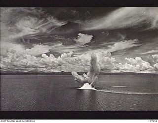 RABAUL, NEW BRITAIN. 1943-11-02. SINKING OF ENEMY (JAPANESE) GUNBOAT OFF VUNAPOPO, NEW BRITAIN. REMAINDER OF RAAF FLIGHT CLOSING IN FOR THE KILL, WHILE ANOTHER FLIGHT FORMS OVER THE BOMB BURST. ..