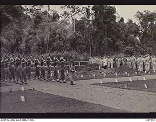 SOPUTA, NEW GUINEA. 1943-09-29. FIRING THE SALUTE AT THE END OF THE BURIAL SERVICE FOR BRIGADIER R. B. SUTHERLAND