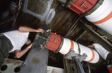 Members of the 43rd Munitions Maintenance Squadron load Mark 52 training mines into a 43rd Strategic Wing B-52G Stratofortress aircraft during Exercise TEAM SPIRIT '85