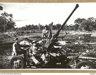 FINSCHHAFEN AREA, NEW GUINEA. 1943-11-09. A 40 MM BOFORS ANTI-AIRCRAFT GUN MANNED BY THE TROOPS OF B BATTERY, 102ND UNITED STATES COAST ARTILLERY (ANTI-AIRCRAFT) BATTALION, PROTECTING TROOPS OF THE ..