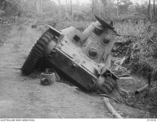 1942-10-01. NEW GUINEA. AUSTRALIAN MILITIA FORCES SUCCESSFULLY OVERCAME A JAPANESE ATTEMPT TO LAND AT MILNE BAY. THIS PICTURE SHOWS A JAPANESE TYPE 95 HA-GO LIGHT TANK KNOCKED OUT DURING THE ..