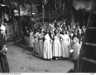 Ramale Valley, New Britain. A group of sisters waving as they prepare to move out of the Ramale Valley Internment Camp. Contact with the camp was made by Allied troops and representatives of the ..