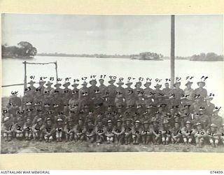 Matupi, New Guinea. 2 July 1944. Personnel of the 15th Field Ambulance at the Matupi Camp. Back row, left to right: VX115989 Acting Corporal (A/Cpl) A. Evans; VX148657 Private (Pte) E. N. Horne; ..