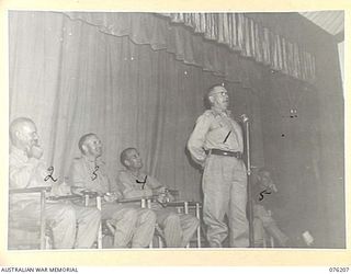 LAE, NEW GUINEA. 1944-09-26. SX21592 BRIGADIER W E H PASCOE, ED, COMMANDER, LAE BASE SUB AREA (1), MAKING HIS SPEECH DURING THE OFFICIAL OPENING OF THE NEW RECREATION HALL BUILT BY MEMBERS OF THE ..