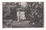 Colonel JK Murray, Evelyn Murray's secretary and Evelyn Murray in the garden at Government House, Port Moresby, c1950