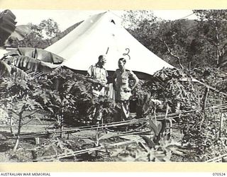 EGGY'S CORNER, PORT MORESBY, PAPUA, 1944-02-20. VX14854 LIEUTENANT COLONEL C.A.M. RENOU, OFFICER IN CHARGE, SURGICAL DIVISION, AUSTRALIAN ARMY MEDICAL CORPS, (AAMC) (1), WITH SX21586 LIEUTENANT ..