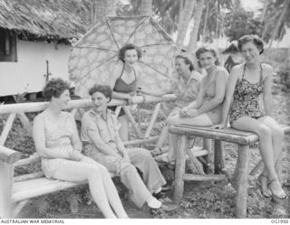 MADANG, NEW GUINEA. C. 1944-10. AFTER DUTY, BATHING COSTUMES ARE DONNED BY THE NURSES AT A MEDICAL RECEIVING STATION IN NEW GUINEA AFTER WORKING HOURS. MOST OF THEIR OFF-DUTY HOURS ARE SPENT ..