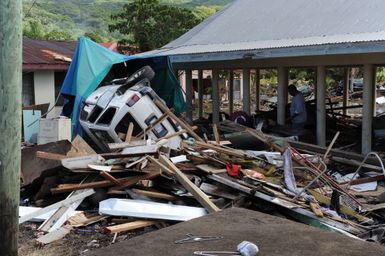 Earthquake ^ Tsunami - Leone, American Samoa, October 2, 2009 -- A car sits upside down among other debris that was caused by the recent earthquake and tsunami in American Samoa. The tsunami spread debris throughout the village of Leone