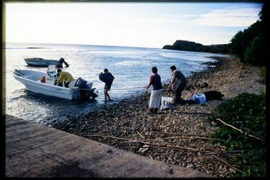 Team members loading boat