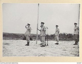 JACQUINOT BAY, NEW BRITAIN, 1945-07-01. HIS ROYAL HIGHNESS, THE DUKE OF GLOUCESTER, GOVERNOR-GENERAL OF AUSTRALIA (1), TAKING THE SALUTE FROM THE GUARD AT WUNUNG AIRSTRIP WHICH WAS DRAWN FROM MOST ..