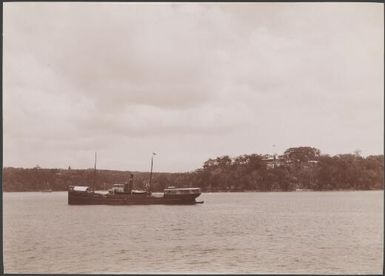 Boat travelling past the British residency, Iririky, New Hebrides, 1906 / J.W. Beattie