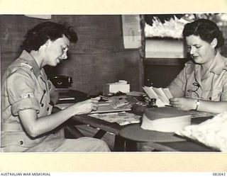 LAE AREA, NEW GUINEA. 1944-11-06. CAPTAIN M.B. CAVE, COMMANDANT, AUSTRALIAN ARMY MEDICAL WOMEN'S SERVICE ATTACHED TO 2/7 GENERAL HOSPITAL (2), WITH LIEUTENANT S. DAMMAN, ASSISTANT COMMANDANT (1)