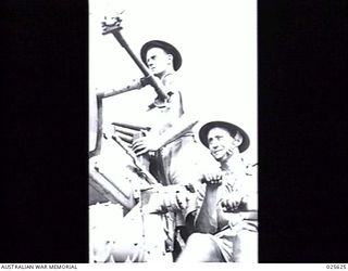 PORT MORESBY, PAPUA, 1942-07. TWO MIDDLE EAST "DIGGERS" NOW IN ACTION IN NEW GUINEA. THEY ARE MEMBERS OF AN ANTI-AIRCRAFT CREW