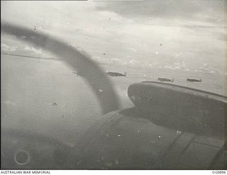 BISMARCK ARCHIPELAGO. 1944-03-28. AIRCRAFT, CODE NAMED UP-T, UP-S, UP-C AND UP-W, OF NO. 79 (SPITFIRE) SQUADRON RAAF, IN FLIGHT OVER NEW BRITAIN EN ROUTE FROM KIRIWINA TO THE ADMIRALTY ISLANDS. ..