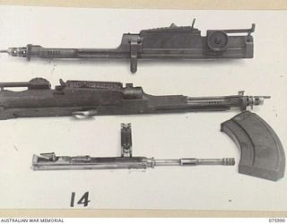 LAE, NEW GUINEA. 1944-09-15. THE EFFECTS OF TROPICAL CONDITIONS ON VARIOUS PARTS OF BREN GUNS USING ATLANTIC RUSTBAN 340L. THESE TRIALS OF CORROSION PREVENTING LUBRICANTS FOR SMALL ARMS UNDER ..