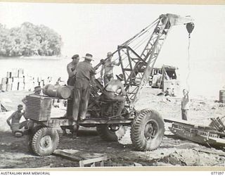 PALMALMAL PLANTATION, NEW BRITAIN. 1944-11-29. A 1 TON MOBILE CRANE OF THE 48TH DEPUTY COMMANDER, ROYAL ENGINEERS (WORKS) LOADING MATERIAL AT THE BEACH DURING THE BUILDING OF A NEW AIRSTRIP