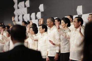 Barack Obama joins Asia Pacific Economic Cooperation Summit leaders and spouses for a group photo in Pasay, Metro Manila, Philippines, November 18, 2015