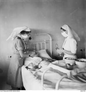 HEIDELBERG, MELBOURNE, VIC. 1945.01.01. CAPTAIN M TISDALL, (1), AND LIEUTENANT J D MONK, AUSTRALIAN ARMY NURSING SERVICE, (3), AT THE PLASTIC SURGERY UNIT, 115 (HEIDELBERG) MILITARY HOSPITAL, ..