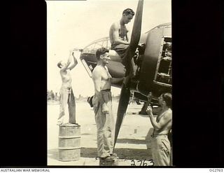 AITAPE, NORTH EAST NEW GUINEA. C. 1945-06. LEADING AIRCRAFTMAN (LAC) LES DONNELLY, QLD, ARMOURER; CORPORAL JIM MULLANEY, WA, FITTER; LAC SYD GRISBROOK, QLD, MECHANIC, AND LAC LEW ROSEWARNE, VIC, ..