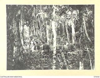 WEBER POINT, NEW GUINEA, 1944-02-14. VX117169 CHAPLAIN F.J. MCKENNA, (ROMAN CATHOLIC), CONDUCTS REQUIEM MASS AT 8TH INFANTRY BRIGADE HEADQUARTERS, FOR WX36148 WARRANT OFFICER II, J.A. KEHOE, 30TH ..