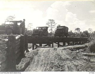 BABIANG ROAD, AITAPE, NEW GUINEA. 1944-12-04. THIS 234 FEET HIGH-LEVEL BRIDGE ACROSS THE DRINIUMOR RIVER BUILT BY ENGINEERS OF NO. 7 PLATOON, 2/8TH FIELD COMPANY, IN TEN DAYS