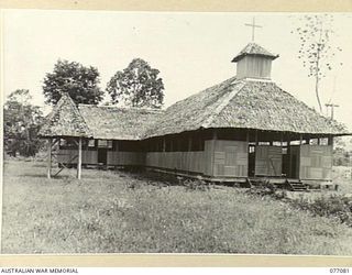 LAE, NEW GUINEA. 1944-11-26. AS A RESULT OF THE IRREPAIRABLE DAMAGE DONE TO THE MALAHANG MISSION CHURCH (LUTHERAN) DURING THE FIGHTING IN THE AREA, THIS NEW CHAPEL WAS BUILT AT THE INSTIGATION OF ..