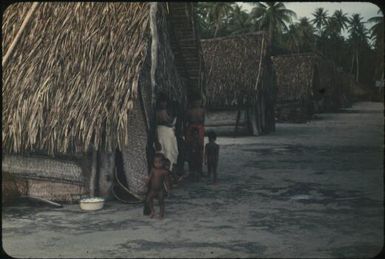 Showing details of houses: note coconut-scraping stool (1) : Mortlock Islands, Papua New Guinea, 1960 / Terence and Margaret Spencer