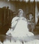 An old Tahitian woman with a child