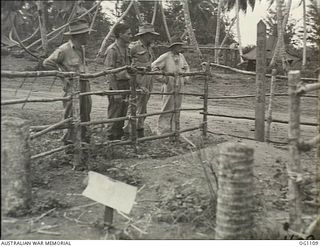 AITAPE, NORTH EAST NEW GUINEA. C. 1944-06. RAAF MEMBERS INSPECTING A JAPANESE GRAVE. SINCE THE GRAVE WAS MUCH MORE ELABORATE THAN OTHERS FOUND IT WAS THOUGHT TO BE PROBABLY THAT OF A SENIOR OFFICER