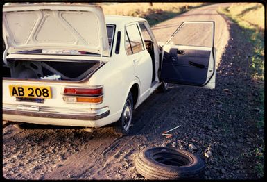 Changing a tyre, Fiji, 1971