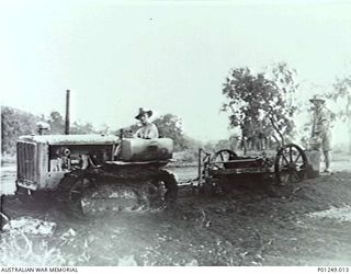 WARDS STRIP, PORT MORESBY, NEW GUINEA, 1943-03. MEMBERS OF THE RAAF LEVEL EARTH, USING A D2 CATERPILLAR CRAWLER TRACTOR TOWING A GRADER. WARDS AERODROME WAS WORKED ON BY BOTH NO. 2 AND NO. 5 MOBILE ..