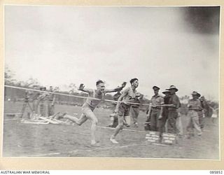 HERBERTON, QLD. 1945-01-19. THE FINISH OF THE 880 YARDS SPRINT DURING THE 9 DIVISION GYMKHANA AND RACE MEETING HELD AT HERBERTON RACECOURSE. THE EVENT WAS DECLARED A DEAD HEAT BETWEEN SERGEANT H C ..