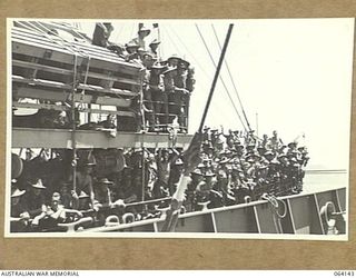 TOWNSVILLE, QUEENSLAND, AUSTRALIA. 1944-01-28. PERSONNEL OF THE 24TH INFANTRY BRIGADE ABOARD THE TROOPSHIP "VAN HEUTSZ" IMPATIENTLY WAITING TO LAND IN AUSTRALIA AFTER A LONG TOUR OF DUTY IN NEW ..