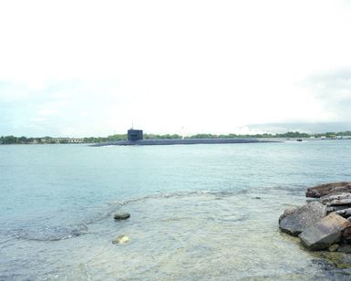 A port beam view of the nuclear-powered strategic missile submarine USS OHIO (SSBN 7260 leaving port during Exercise RIMPAC '86