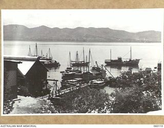 NAPA NAPA, NEW GUINEA. 1943-11-12. GENERAL VIEW OF THE 2ND AUSTRALIAN WATERCRAFT WORKSHOPS, AUSTRALIAN ELECTRICAL AND MECHANICAL ENGINEERS, SHOWING SHIPS WAITING TO BE REPAIRED OR UNDERGOING REFITS