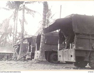 NORTH ALEXISHAFEN, NEW GUINEA. 1944-09-14. A NEAT LINE-UP OF MOBILE STORES TRUCKS AT THE 133RD BRIGADE ORDNANCE FIELD PARK. IDENTIFIED PERSONNEL ARE: NX110628 CORPORAL A.D. LAWRENCE (1); NX156672 ..