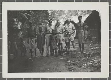 A group of soldiers with Papua New Guineans on Nissan