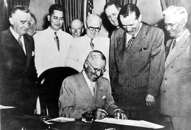 Truman signing Guam Civil Government Act