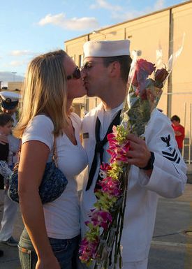 PEARL HARBOR, Hawaii (Dec. 12, 2006) Electronics Technician 1ST Class Ryan Sweetser greets his wife after the nuclear-powered fast-attack submarine USS BUFFALO (SSN 715) returned from a six-month deployment to the western Pacific. This marked BUFFALO's last Pearl Harbor homecoming, as it is scheduled to transfer to Guam next year. U.S. Navy photo by Mass Communication SPECIALIST 1ST Class Cynthia Clark (Released)