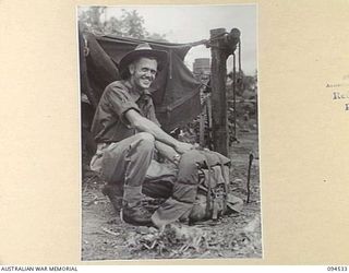 CAPE WOM, WEWAK, NEW GUINEA, 1945-07-29. LANCE CORPORAL J.W. BORWICK (1) AT 6 DIVISION RECEPTION CAMP, AWAITING RETURN TO AUSTRALIA UNDER A PLAN OF DISCHARGE FOR MEN WHO SERVED FIVE YEARS. HE ..