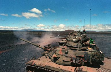 M-60A1 RISE (Reliability Improved Selected Equipment) main battlae tanks of A Troop., 3rd Squadron, 4th Cavalry, 25th Infantry Divison, fire their guns on the tank live-fire range at the Pohakuloa Training Area