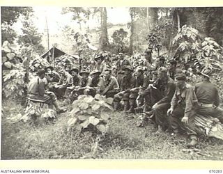 DUMPU, RAMU VALLEY, NEW GUINEA, 1944-02-11. SX15733 CAPTAIN GRATTON (1) THE REGIMENTAL MEDICAL OFFICER, LECTURING OFFICERS AND NON COMMISSIONED OFFICERS OF THE 57/60TH INFANTRY BATTALION