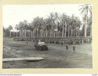 AITAPE, NEW GUINEA. 1945-02-23. VX17 MAJOR- GENERAL J.E.S. STEVENS, DSO, ED, GENERAL OFFICER COMMANDING 6TH DIVISION, INSPECTING THE 2/4TH INFANTRY BATTALION DURING HIS VISIT TO THE 19TH INFANTRY ..