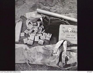 YULE ISLAND, NEW GUINEA, 1944-11TH TO 20TH MAY. COMFORTS FROM THE AUSTRALIAN COMFORTS FUND AT THE 1ST MARINE FOOD SUPPLY PLATOON. THE GOODS ARE FOR DELIVERY TO MEMBERS OF THE CATHOLIC MISSION ON ..