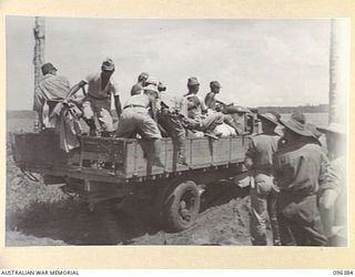KAIRIRU ISLAND, NEW GUINEA, 1945-09-11. JAPANESE TRUCK LOADED WITH STORES AND NAVAL PERSONNEL FOR TRANSFER FROM KAIRIRU TO MUSCHU ISLAND. FOLLOWING THE SURRENDER OF THE JAPANESE THE ISLANDS ARE NOW ..