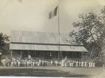 Papeete schools, teachers and pupils gathered in front of a building, for what seems to be a French flag-raising ceremony