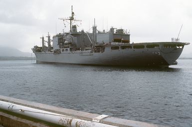 Port quarter view of the combat stores ship USS NIAGARA FALLS (AFS 3) arriving at Naval Station Guam