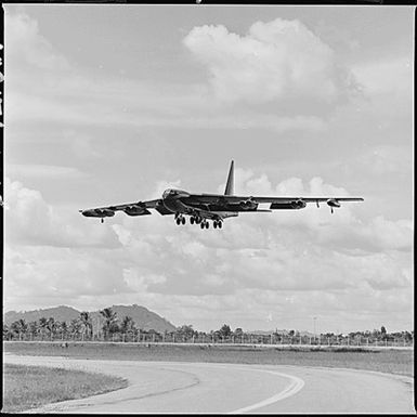 U-Tapao Air Base,Thailand. Low angle, 3/4 front view of a U.S. Air Force B-52 aircraft coming in for a landing after a mission over South Vietnam for deployment of B-52 aircraft from Guam U-Tapao during Typhoon Olga.