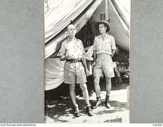 NEW GUINEA. 1942-08-04. THE FIRST MEN TO SIGHT THE JAPS IN BUNA. SERGEANT BISHOP OF THE 1ST PAPUAN INFANTRY BATTALION (LEFT) AND LIEUTENANT CHAMPION, RESIDENT OFFICER AT BUNA