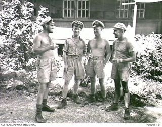 BISMARCK ARCHIPELAGO, 1945. A GROUP OF FOUR NAVAL PERSONNEL AT EMIRAU ISLAND. (RNZAF OFFICIAL PHOTOGRAPH.)
